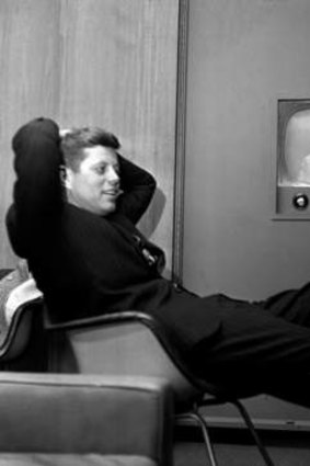 Candid camera: JFK watches his televised appearance for the Wisconsin presidential primary.