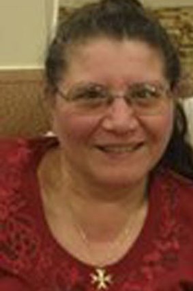 Maria Lourdes (Lou) Devrell was found in a pool of blood in the dining room.