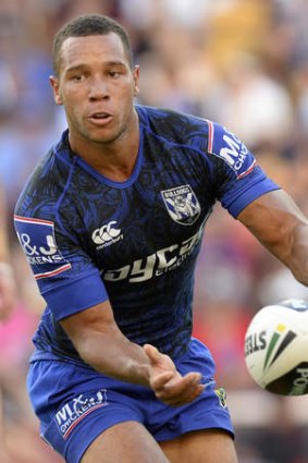 Rookie sensation: Moses Mbye of the Bulldogs gets an offload away during his side's trial win over the Storm in Brisbane on Sunday.