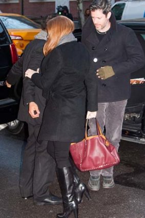 Amy Adams carries the Valentino bag, but does not wear UGG boots.