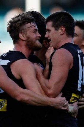 John McCarthy (left) celebrates with teammates last year.