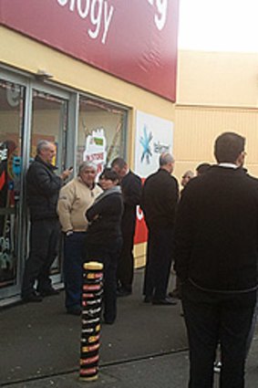 Tech rage ... Early bird customers queue outside a Noel Leeming electronics store in Wellington, New Zealand.
