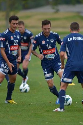 Sharp: Victory's Billy Celeski (centre) at training at Gosch's Paddock on Friday.