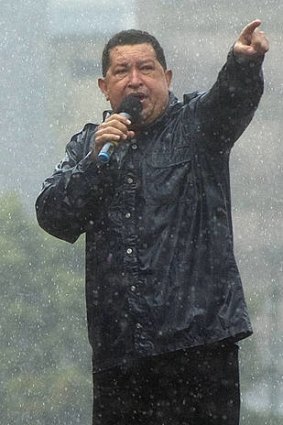 Raining power ... the Venezuelan President, Hugo Chavez.