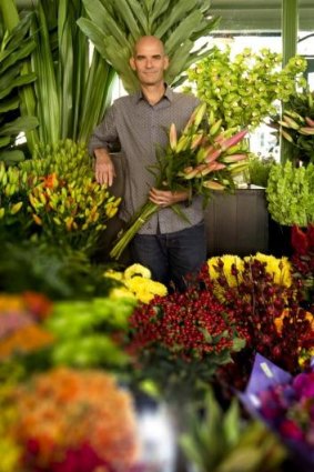 Florist Andrew Smith is surrounded by blooms after his early-morning trip to the market.