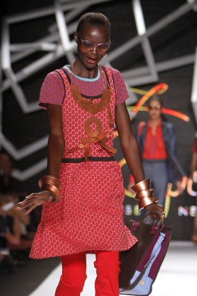 A model stumbles before falling on the runway at the Z Spoke by Zac Posen Spring 2011 collection in New York.