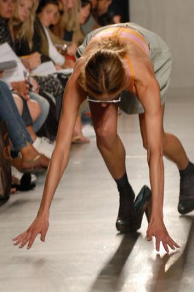 A model trips and falls during the Proenza Schouler Spring 2007 runway show during New York Fashion Week.