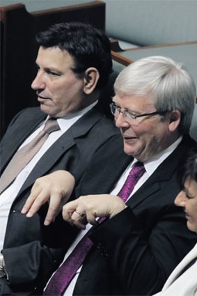 Kevin Rudd makes hand motions during a division.