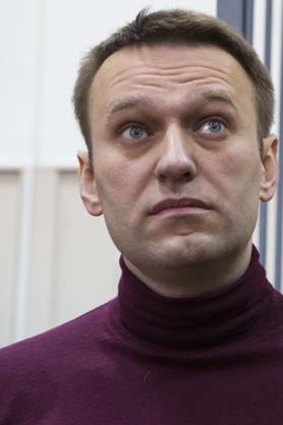 Russian opposition activist and anti-corruption crusader Alexei Navalny listens at a court room in Moscow, where he was put under house arrest.