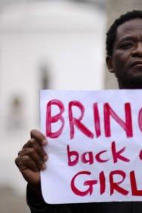World-wide push for action ... A protester holds a sign during a march in support of the girls kidnapped in Nigeria by members of Boko Haram, in Cape Town, South Africa.
