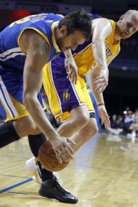 Golden State Warriors centre Andrew Bogut with Los Angeles Lakers counterpart Chris Kaman.