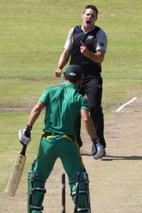 New Zealand's Mitchell McClenaghan gets through the defences of Davy Jacobs during the warm-up T20 match against South Africa A.
