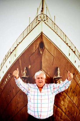 Billionaire Clive Palmer at the Palmer Coolum Resort infront of a Titanic poster.
