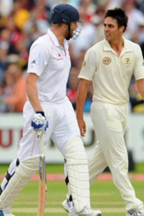 Standing their ground ... Mitchell Johnson exchanges words with Andrew Flintoff.