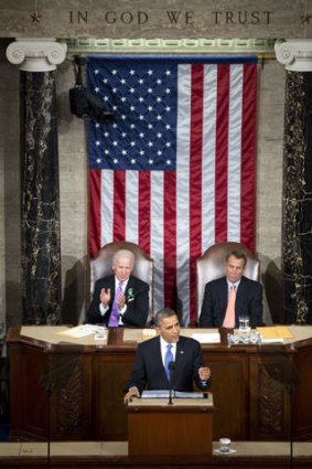 US President Barack Obama delivers the State of the Union in front of Vice President Joe Biden and House Speaker John Boehner.
