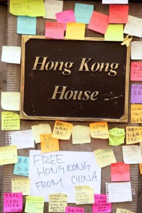 Colorful post-it notes are stuck on the outside of Hong Kong House in Sydney.