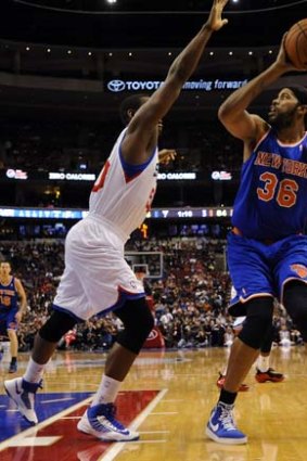 Rasheed Wallace of the Knicks shoots over Lavoy Allen of the Sixers.