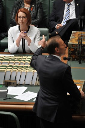 Question time: Tony Abbott has the floor, but Julia Gillard has other issues pending.