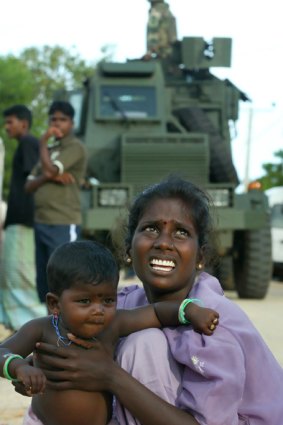 A Tamil woman and her daughter arrive at a camp for refugees fleeing internal violence in Sri Lanka. The conditions in these camps is one reason for an influx of Tamil asylum seekers.