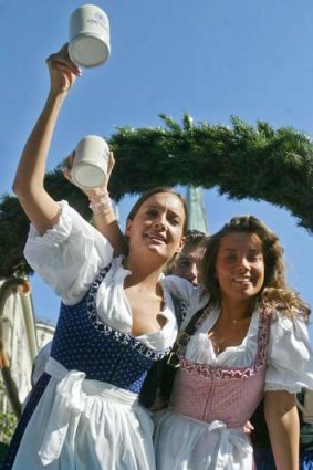 Two women wearing "dirndls" the Bavarian traditional clothes, during the opening parade of Munich's famed Oktoberfest beer party.