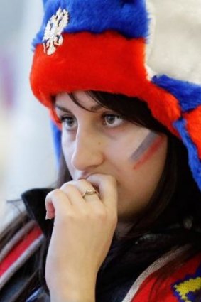 Sadness ... A Russian fan leaves the arena after their team's 3-1 loss to Finland during the men's quarterfinal hockey.