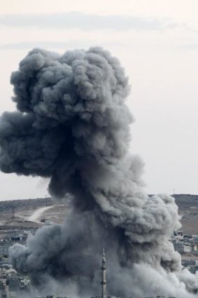 Smoke rises following a US air strike on Kobane on Saturday.