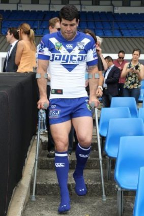Little to no chance of playing: Injured Canterbury captain Michael Ennis hobbles away from the media at Belmore on Tuesday.