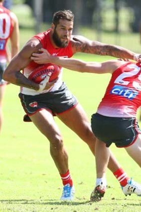 Go away: Lance Franklin asserts his authority at Sydney training on Tuesday.