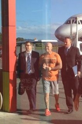 Ivan Tesic arrives on the Gold Coast with two detectives.