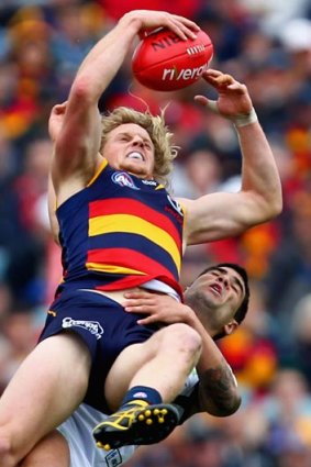 Out of reach... the Crows' Rory Sloane takes the mark over Docker Clancee Pearce at AAMI Stadium.