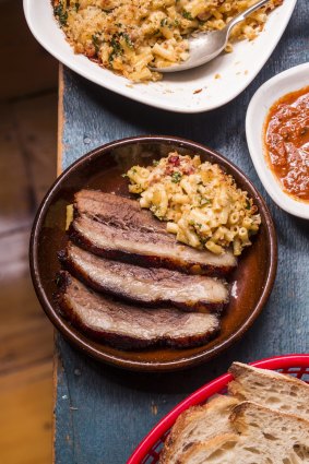 Barbecued beef brisket with macaroni and cheese.