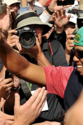 Tiger Woods meets some fans.