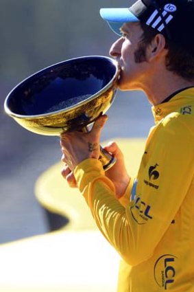 Bradley Wiggins of Britain kisses the trophy as he celebrates his Tour de France victory.