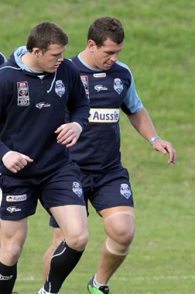 Back in Blue ... Greg Bird, right, trains with Blues teammate Brett Morris in Wollongong during the week.