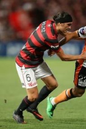 Big task .. Jerome Polenz challenges Brisbane's Thomas Broich.