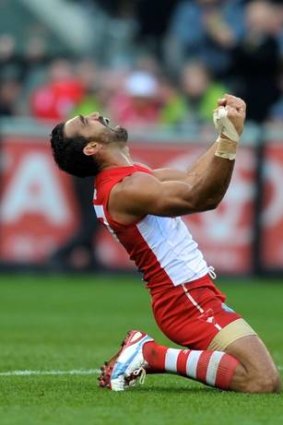 Adam Goodes celebrates after the final siren of the 2012 AFL Grand Final.