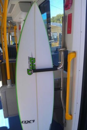 A surf board track being used on one of the new Gold Coast trams.