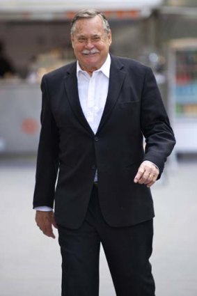 Former footballer Ron Barassi outside the County Court.