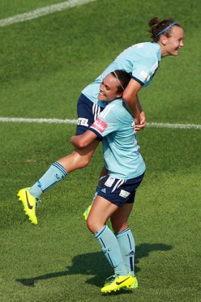 Sydney FC's Caitlin Foord is congratulated by Emma Kete after scoring her third goal against Perth Glory.