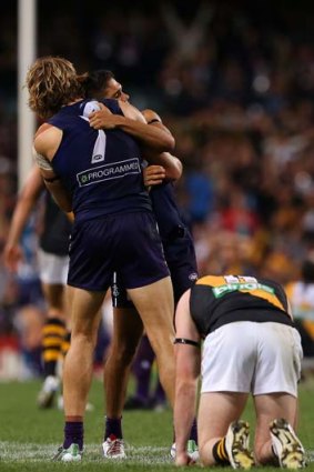 Onya mate: Fremantle’s Michael Walters and Nat Fyfe celebrate the one-point win over Richmond.