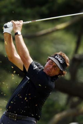 Phil Mickelson of the United States hits his tee shot on the ninth hole during Round One of the 113th US Open in Pennsylvania.