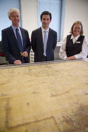 Historic ... Curator of maps at the National Library, Martin Woods, chairman of the National Library of Australia Council, Ryan Stokes and manager of preservation, Robin Tait with the 1663 <i>Archipelagus Orientalis (The Eastern and Asian Archipelago). </i>