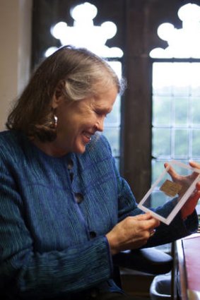 Harvard University divinity professor Karen King holds a fourth century fragment of papyrus that she says is the only existing ancient text that quotes Jesus explicitly referring to having a wife.