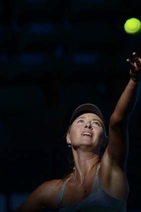 Aiming high ... Maria Sharapova serves against Ekaterina Makarova during their match at the Australian Open.