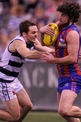 Geelong's Jesse Stringer battles with Port Melbourne's Toby Pinwill in the VFL grand final.