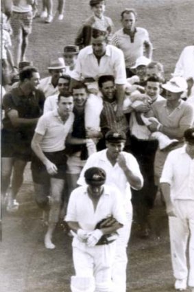 Over and out ... Ian Meckiff is chaired off the field by spectators after the innings in which he bowled only one over and was no-balled four times on December 7, 1963, during the Brisbane Test. He did not play for Australia again.