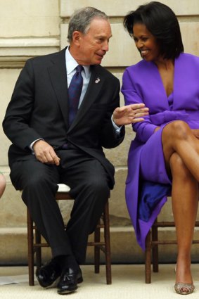 First lady of the United States Michelle Obama (R) chats with New York City Mayor Michael Bloomberg at a ribbon cutting ceremony for the official re-opening of the newly renovated American Wing at the Metropolitan Museum of Art in New York