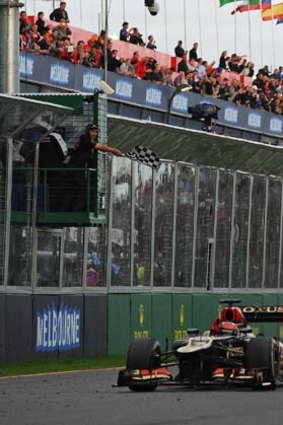 That's how you do it: Kimi Raikkonen cruises to the line in the Australian Grand Prix.