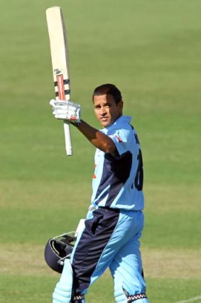 Taking his chance ... Usman Khawaja scores 100 runs during the Ryobi One Day Cup match between South Australia and NSW.