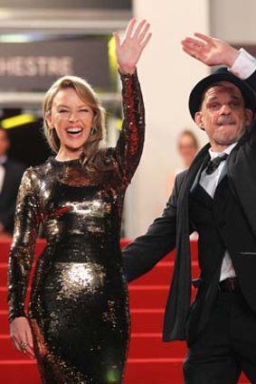Kylie Minogue and Denis Lavant arrive at Cannes for the screening.